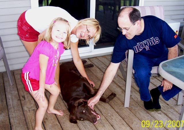 100_3076.JPG - Sydney, Joy, and Mark with Jake, the Wilbur's chocolate lab.