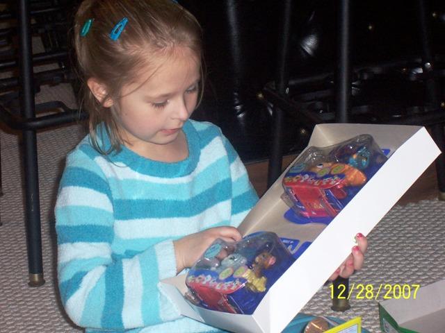 100_3402.JPG - Sydney opening some of her presents.