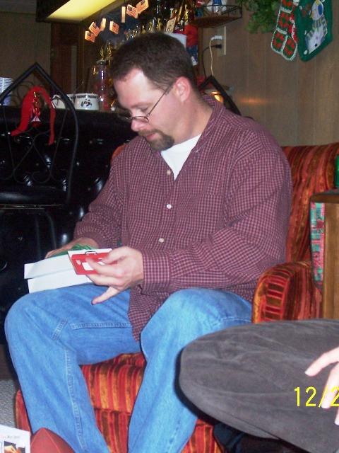 100_3417.JPG - Don opening his next gift.