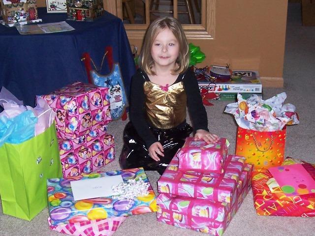 100_3442.JPG - Sydney opening her birthday presents.