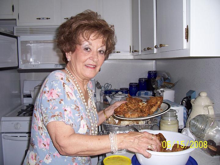 100_3767.JPG - Sharon heating up the chicken.
