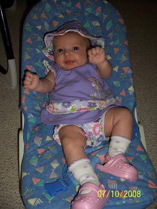 100_3810.JPG - ... and showing off her new shoes.