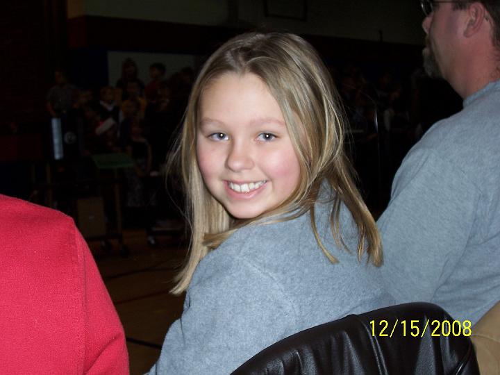 100_4258.JPG - Kaitlyn waiting to watch Sydney sing.