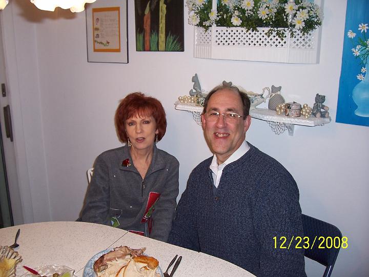 100_4278.JPG - Pam and Mark trying to eat all the food that was already prepared.