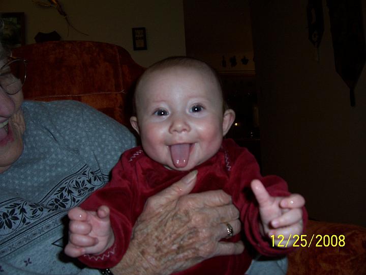 100_4344.JPG - Dad Jeremy has been teaching her to stick out her tongue!