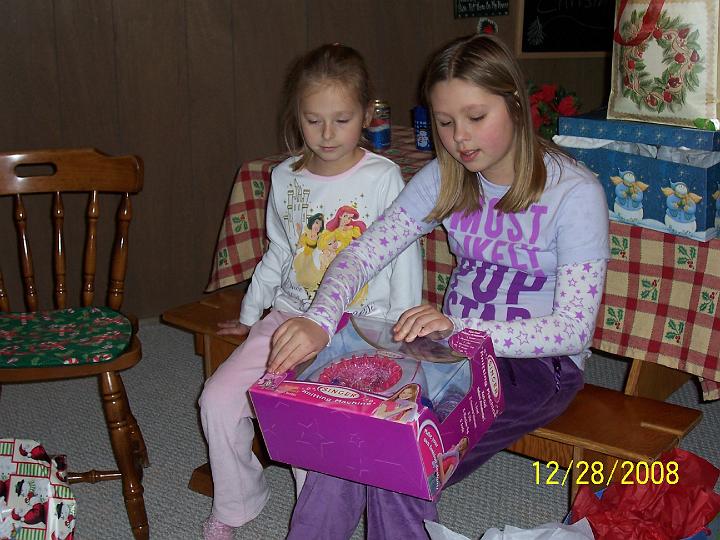 100_4404.JPG - Sydney and Kaitlyn opening gifts.