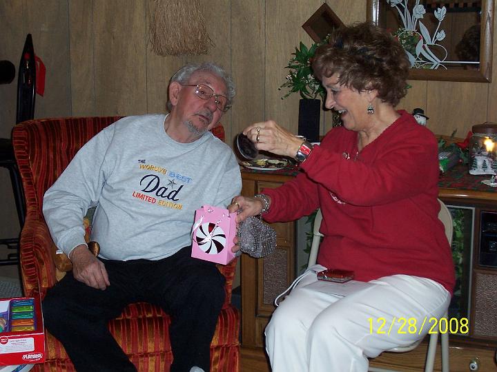 100_4430.JPG - Chet and Sharon opening presents.