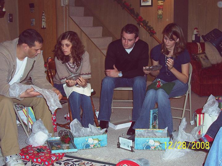 100_4485.JPG - Robin and Gina opening their keepsake presents.