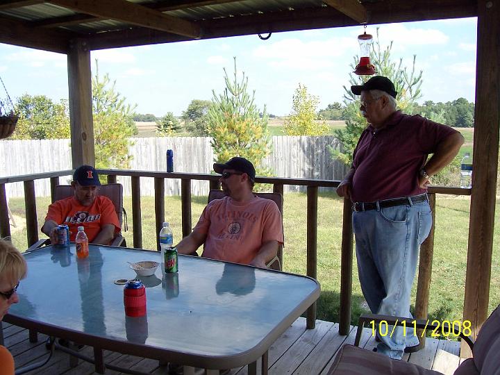 100_4080.JPG - Mark, Don Jr., and Don Sr. sharing tall tales.