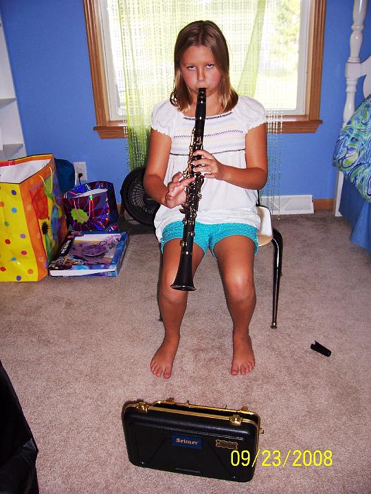 100_4013.JPG - Kaitlyn practicing her clarinet.