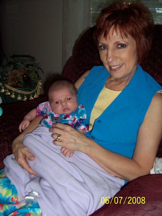 100_3705.JPG - Macie cuddled up to Granny.
