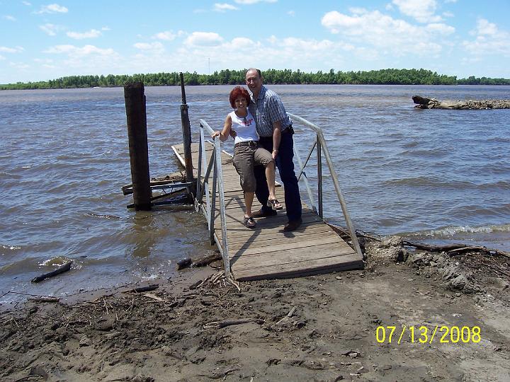100_3827.JPG - Mark trying to throw Pam off the damaged boat dock into the Mississippi.