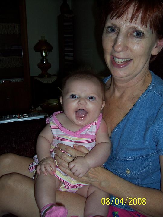 100_3844.JPG - Macie with a big smile on Granny's lap.