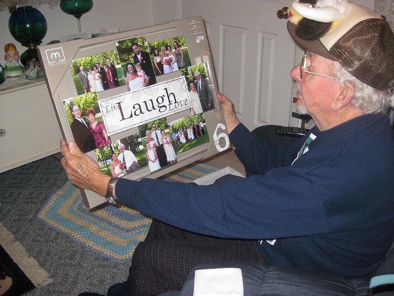 IMG_1235.JPG - Misty and Trevor gave Papa a photo collage frame from their wedding.