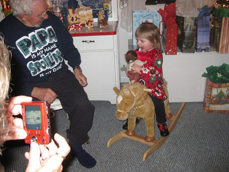IMG_1240.JPG - Macie got a rocking horse whose head moved and whinnied.