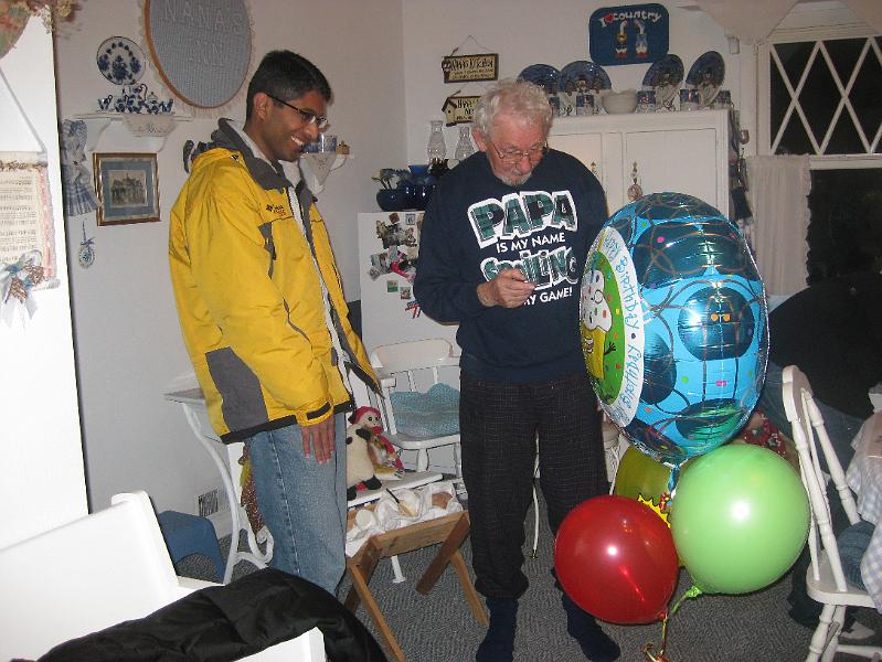 IMG_1242.JPG - Bimal and Chet checking out the birthday ballon bouquet.