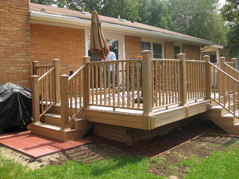 IMG_0990.JPG - All finished with the deck.  Next year's project will be to extend the block patio to connect the two stairs.