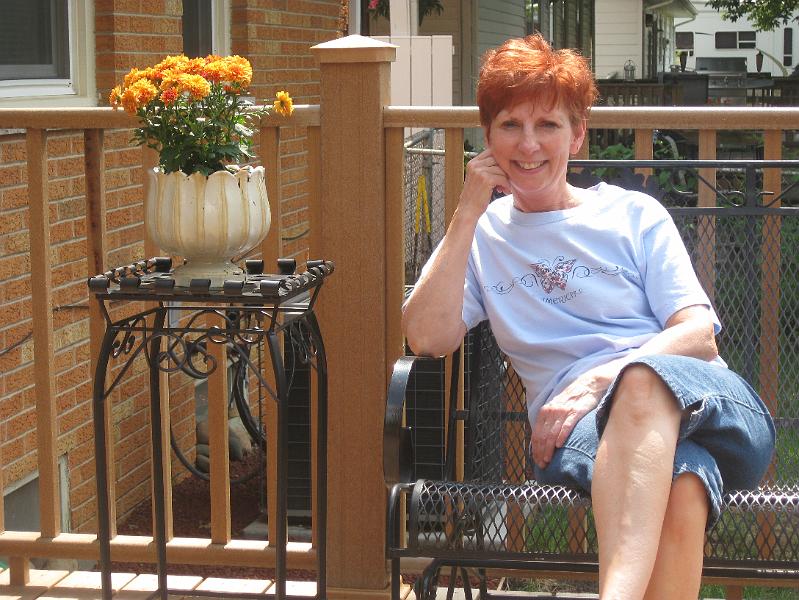 IMG_0998.JPG - A couple of plant stands, a couple of plants, and Pam plants herself in the glider...
