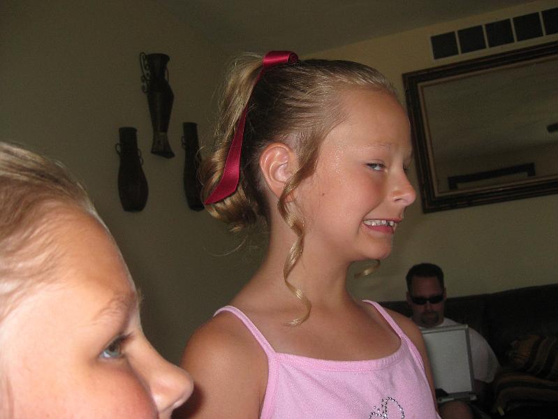 IMG_0649.JPG - Sydney modeling her hairdo.