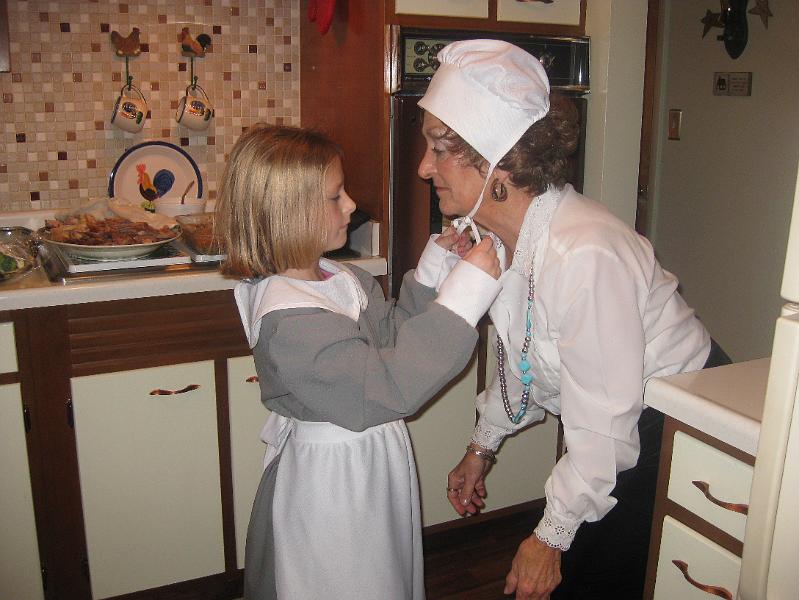 IMG_1152.JPG - Sydney tries to show Nana how to tie the bonnet...