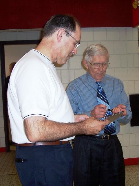 100_2195.JPG - Mark getting an autograph from Mosie Lister.