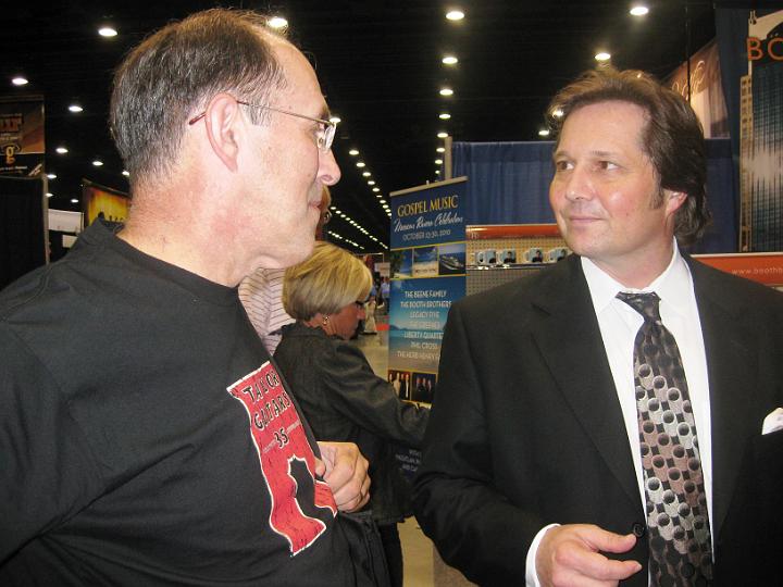 IMG_1001.JPG - Mark and Ronnie Booth discuss the merits of Taylor Guitars (he noticed the shirt I was wearing...)